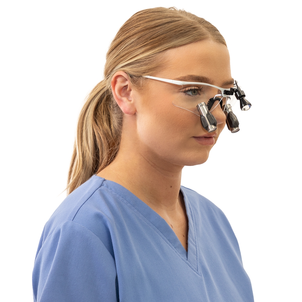 Female Dentist wearing Q-Optics Loupes and Light