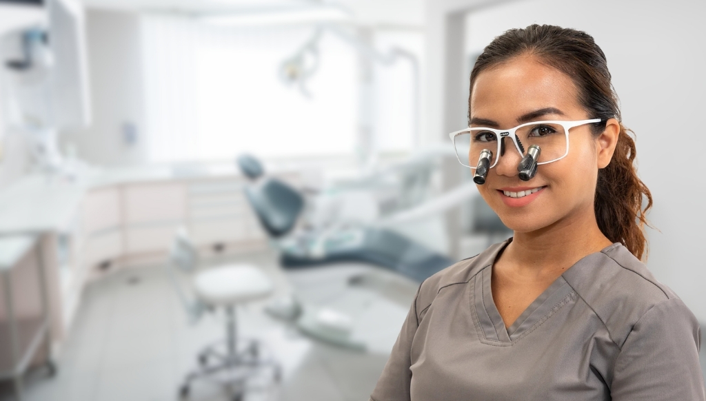 Dental professional wearing Q-Optics Prismatic loupes in dental surgery