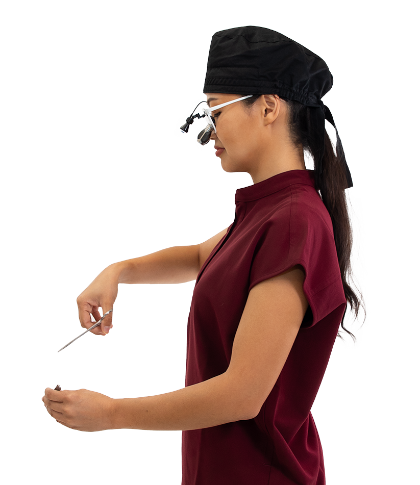 Female student dental nurse wearing Q-Optics Prismatic Loupes and light